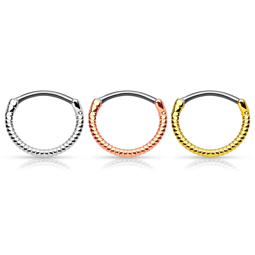 Septum clicker kierretyllä muodolla